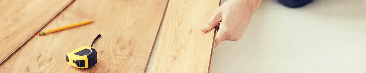 A professional installing wood flooring in Sioux Falls, SD