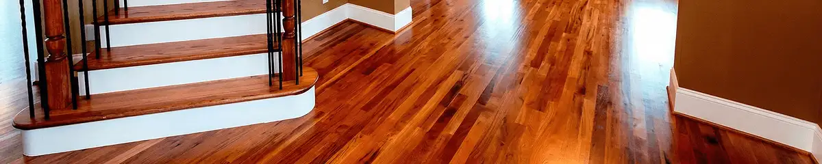 Base floor of a staircase with professionally restored wood flooring in Sioux Falls SD