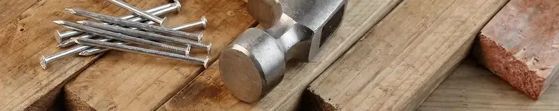 Hammer and nails on hardwood flooring boards in Sioux Falls, SD
