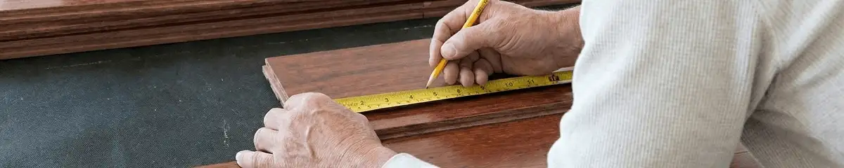 A professional installing wood flooring in Sioux Falls, SD